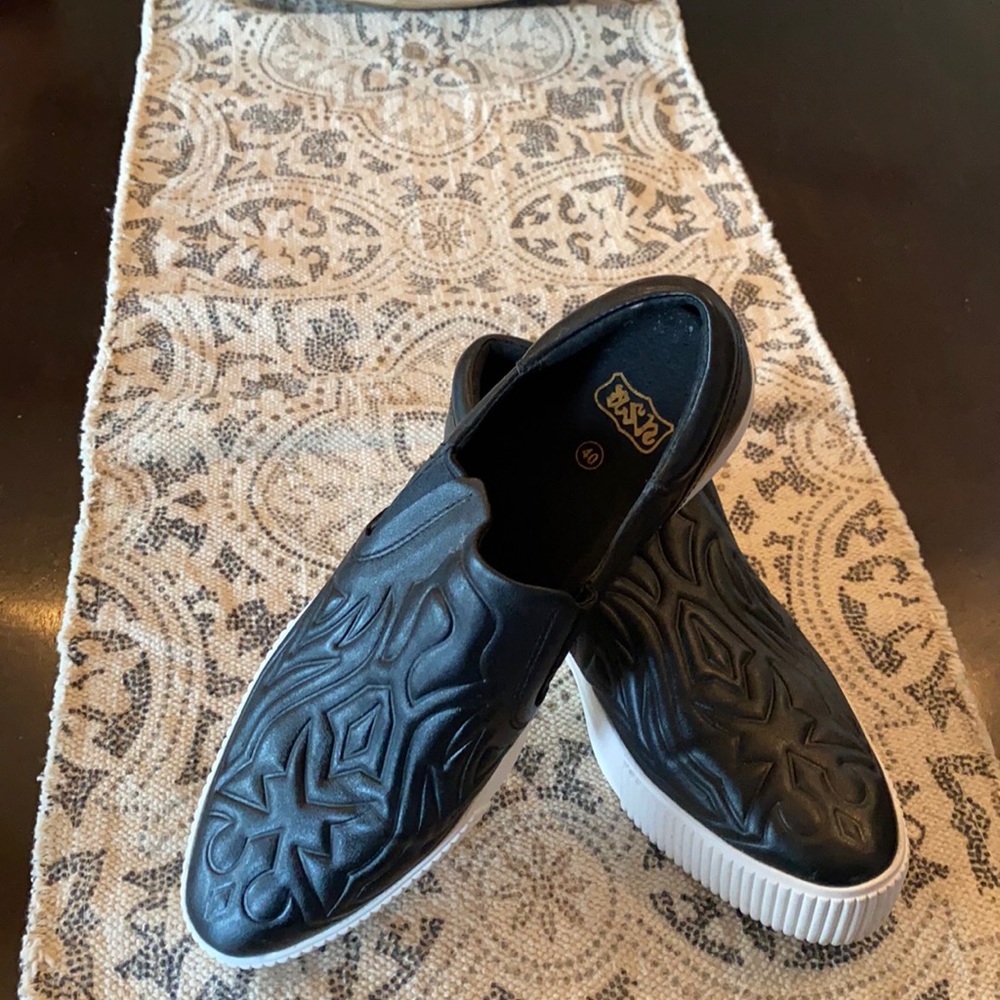 Black embossed leather platform slip-on sneaker